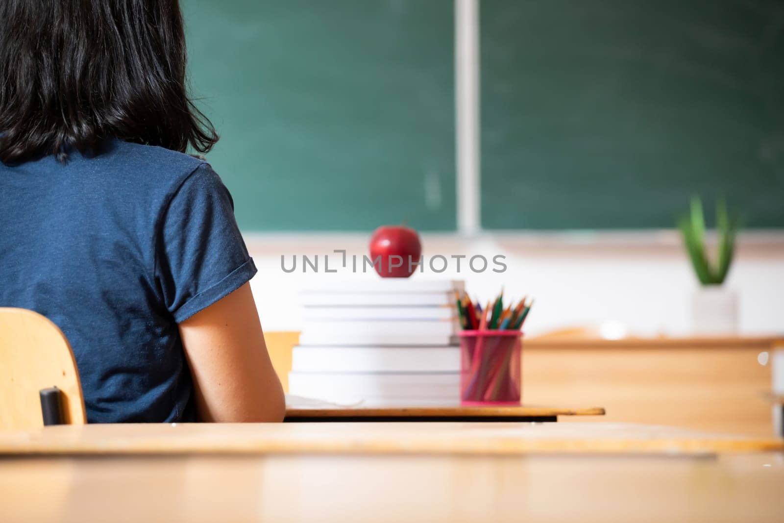 Back to school concept: studens in the classroom at the begining of the new school season.