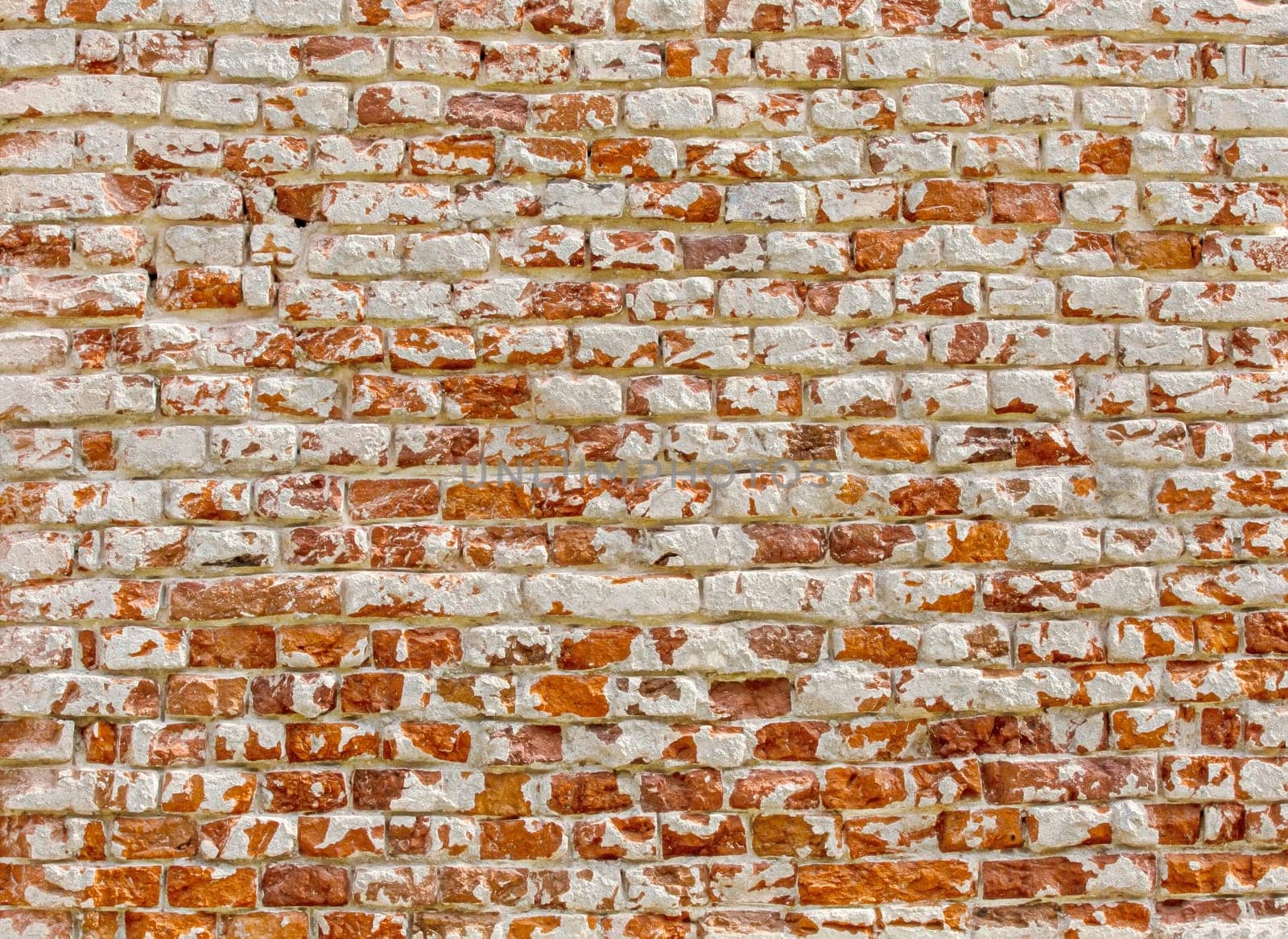 The Old brick wall with white paint background texture close up