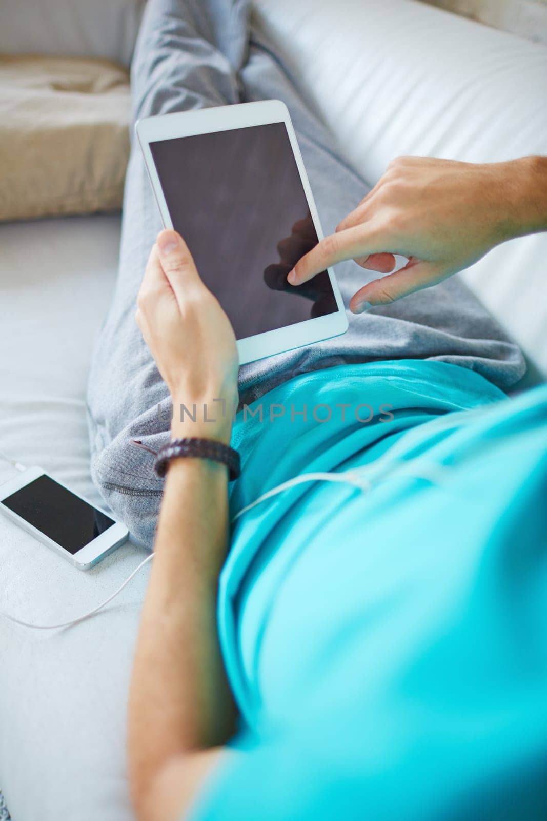 Young man using modern gadgets at leisure