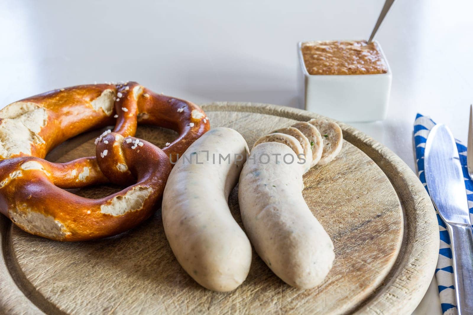 A snack - white sausage and pretzel