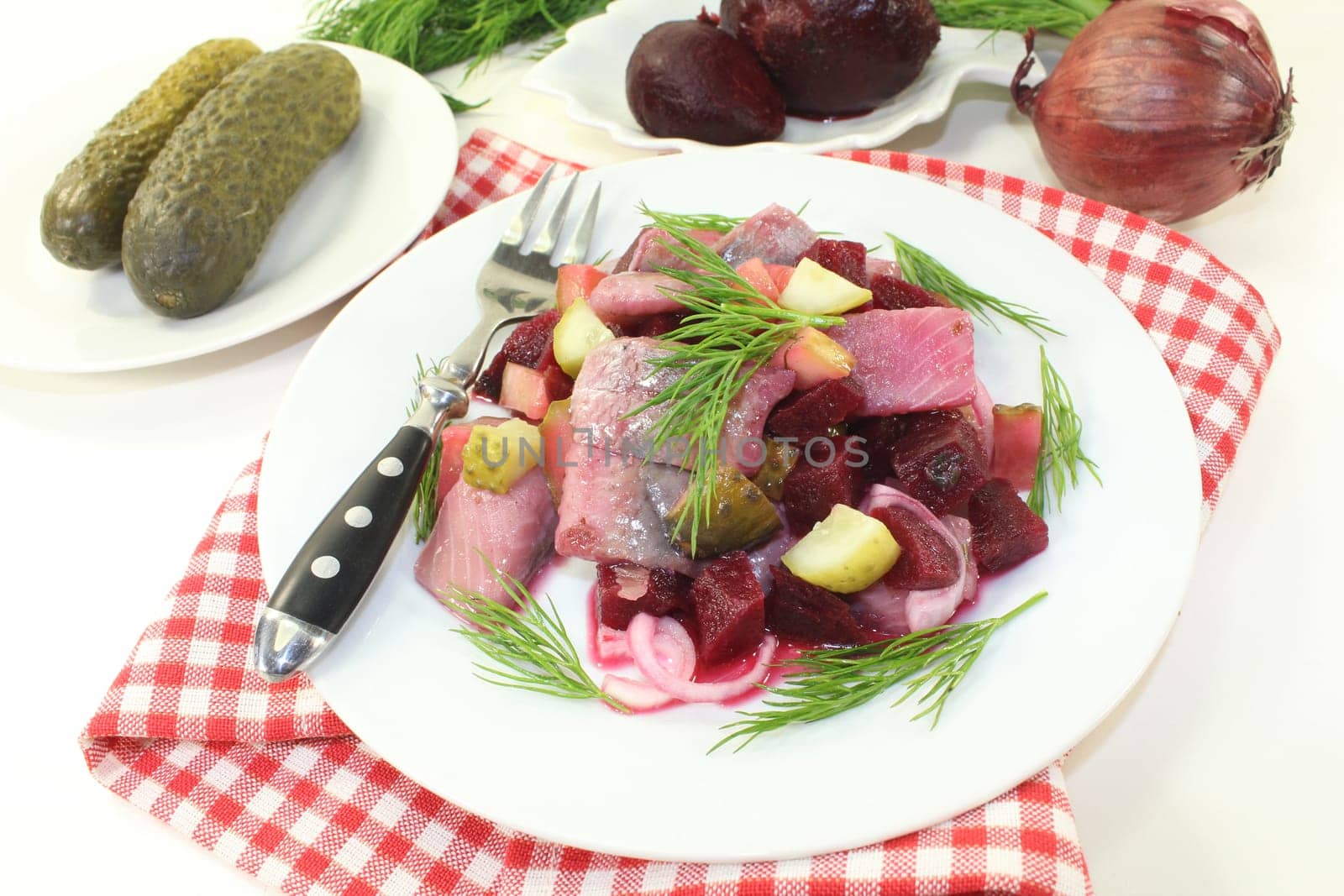 Matjessalat with beetroot,onions and sour cucumber