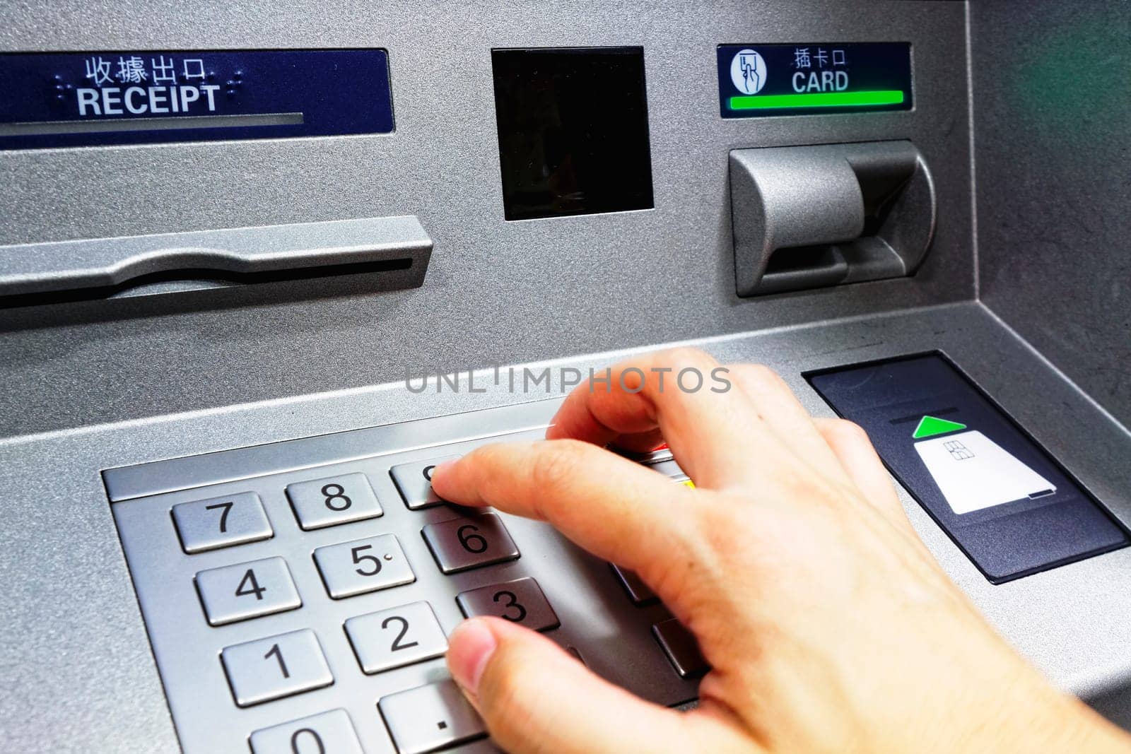 ATM - entering pin close up