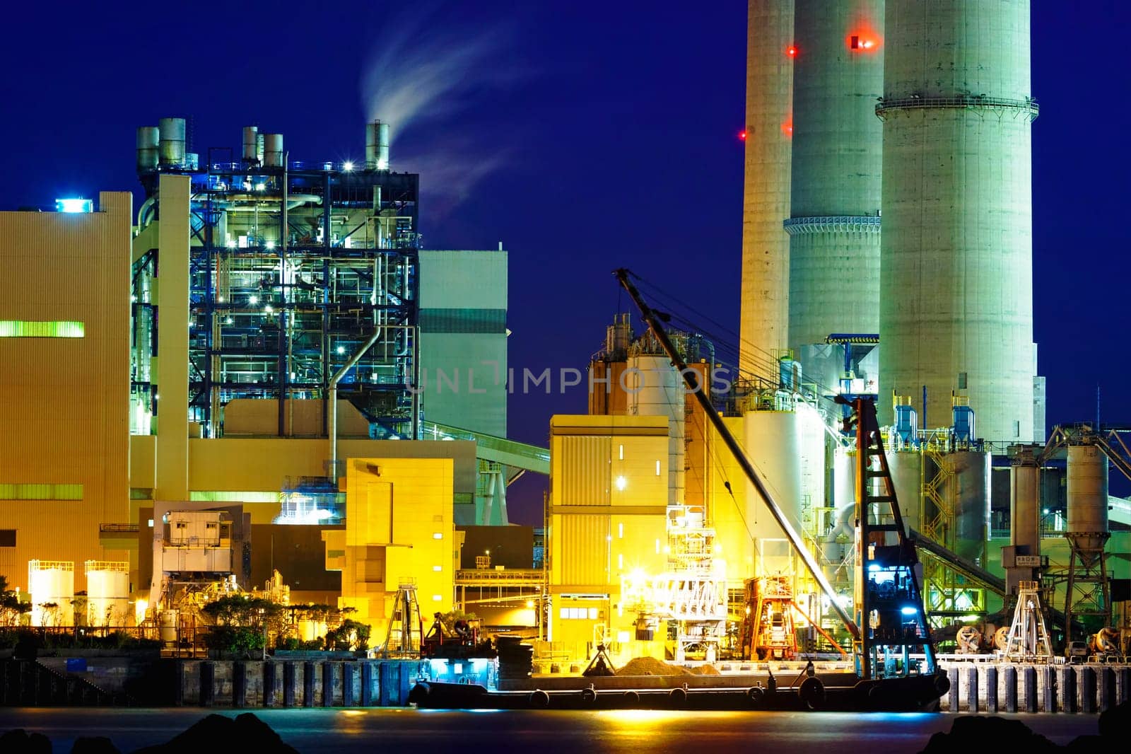 power station at night with smoke , hong kong