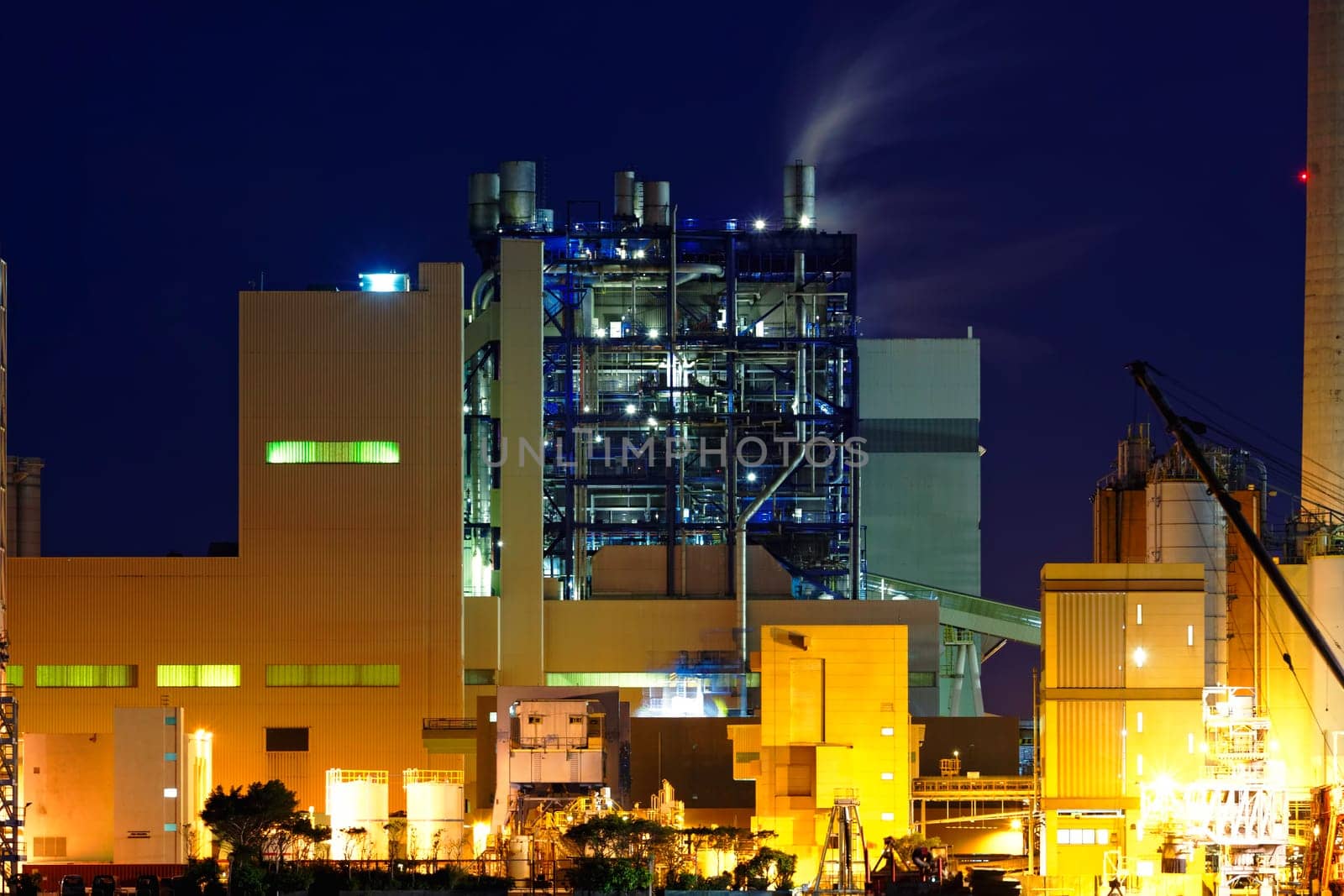 power station at night with smoke , hong kong