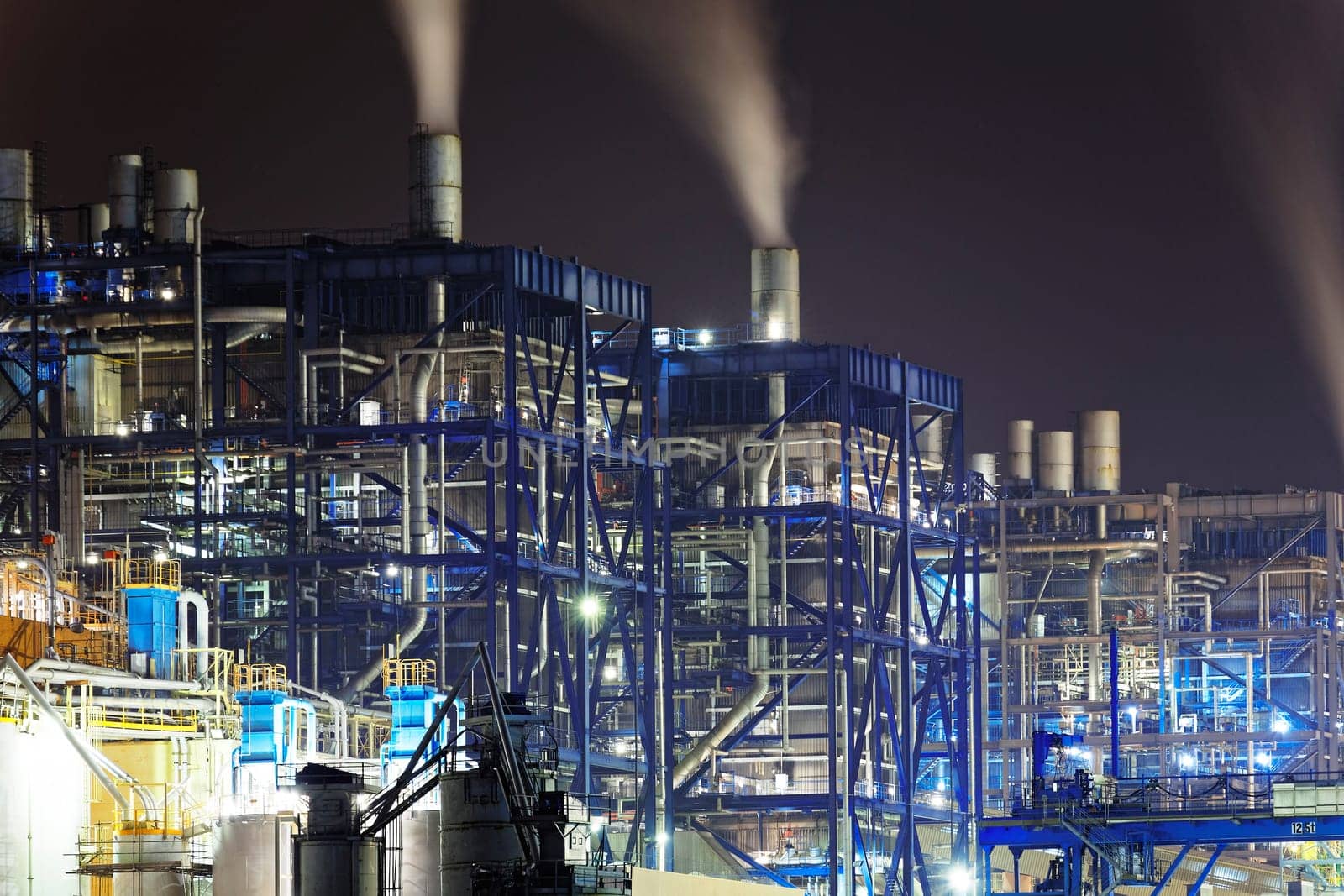 power station at night with smoke, hong kong