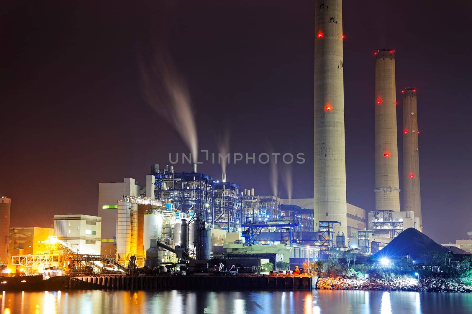 power station at night with smoke, hong kong