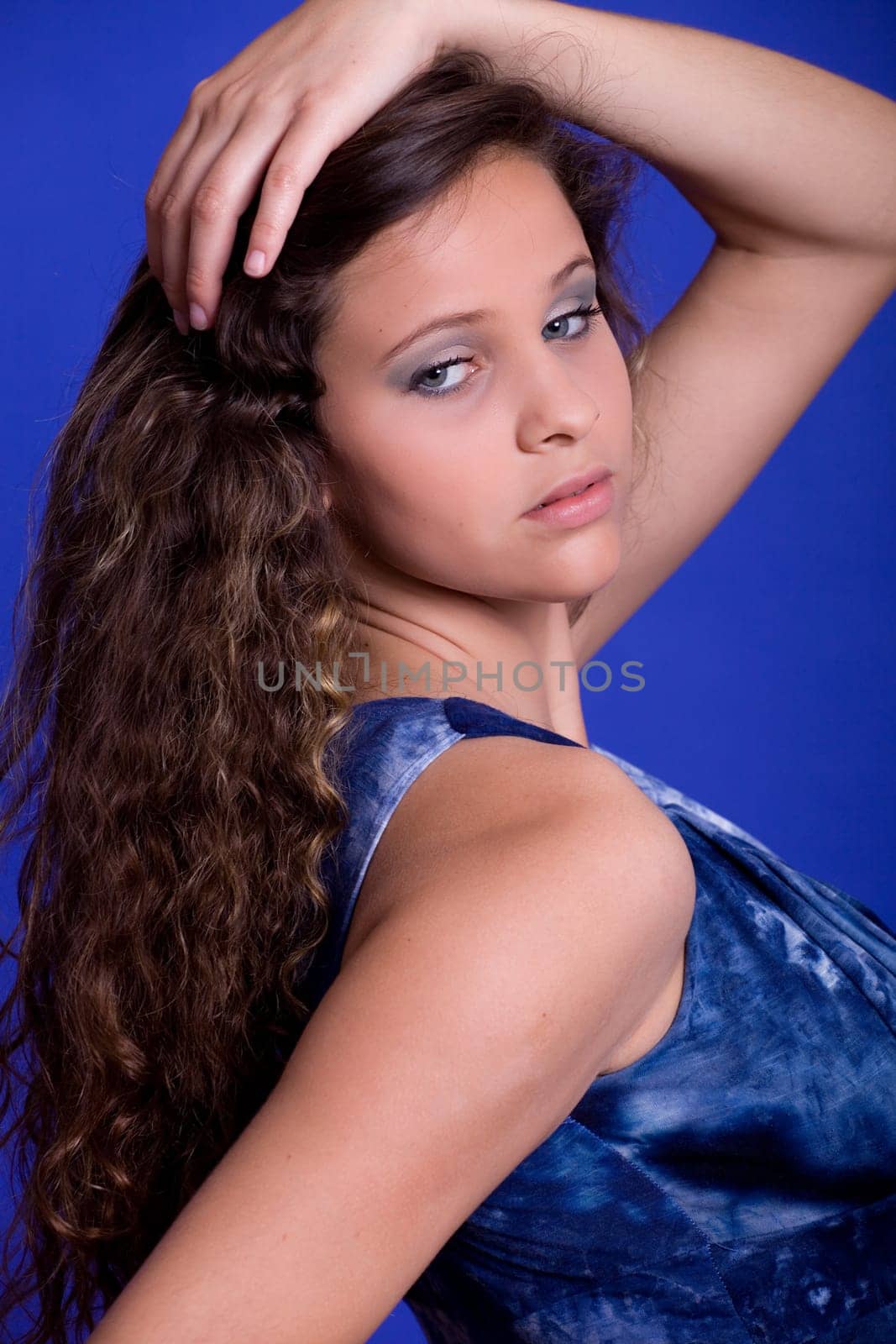 young beautiful woman, on a blue background