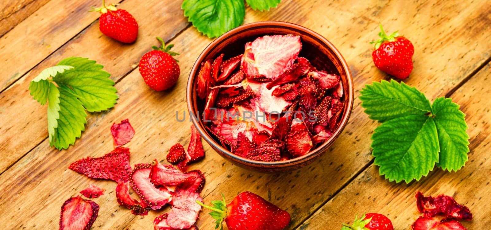 Dried summer berry,fruit dessert.Strawberry chips,berry sweetness in bowl