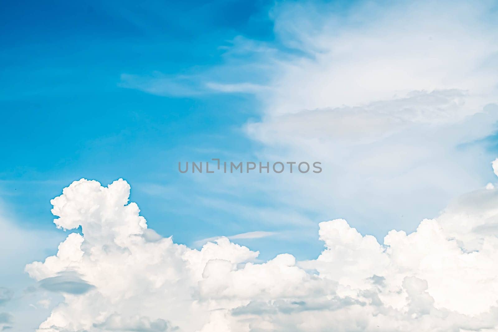 Beautiful white fluffy clouds sky background with blue sky background for copy space