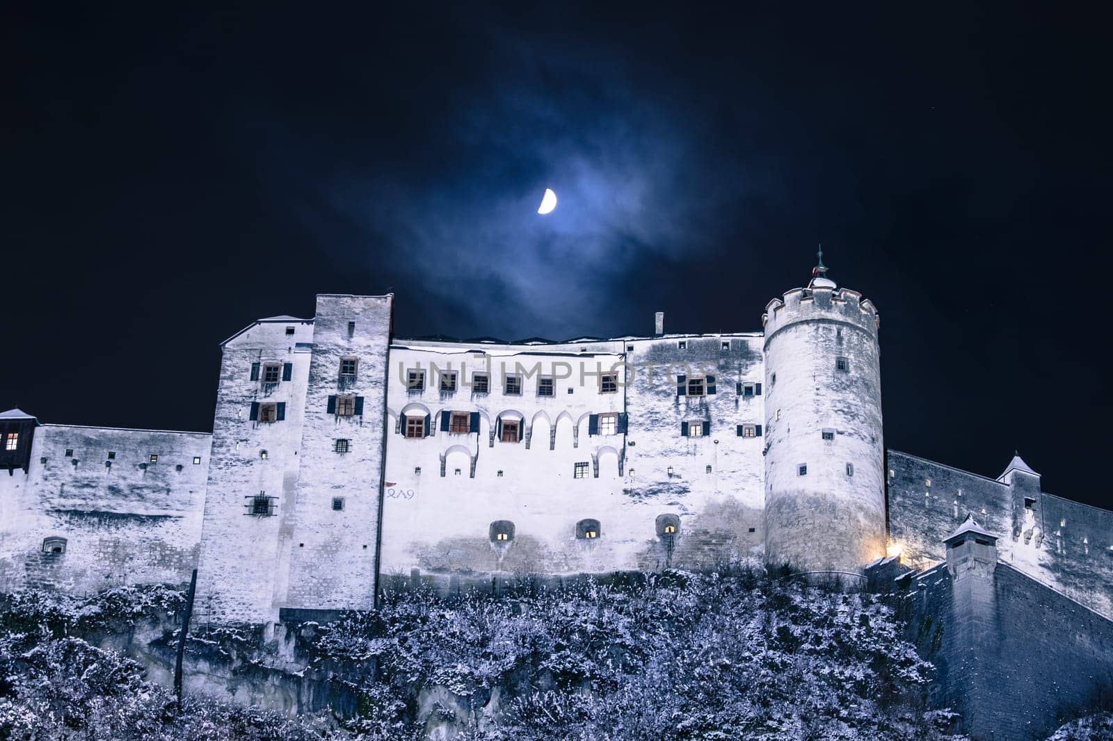 Fortress of Salzburg and the moon: Winterly in the night.