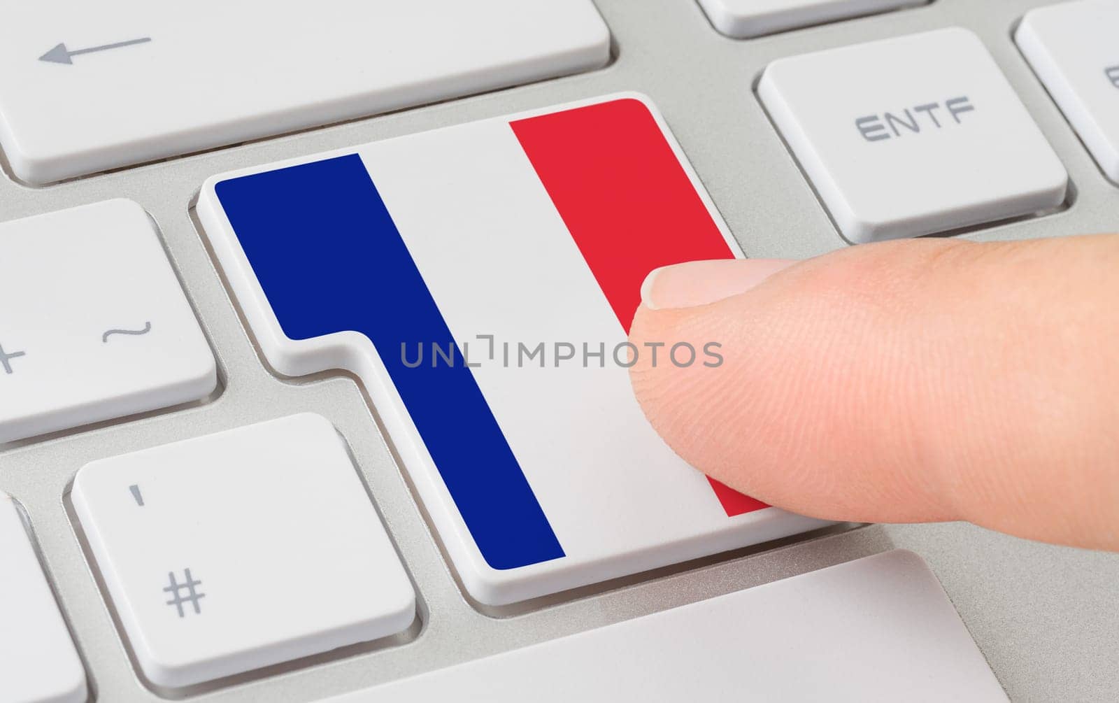A keyboard with a labeled button - Flag of France