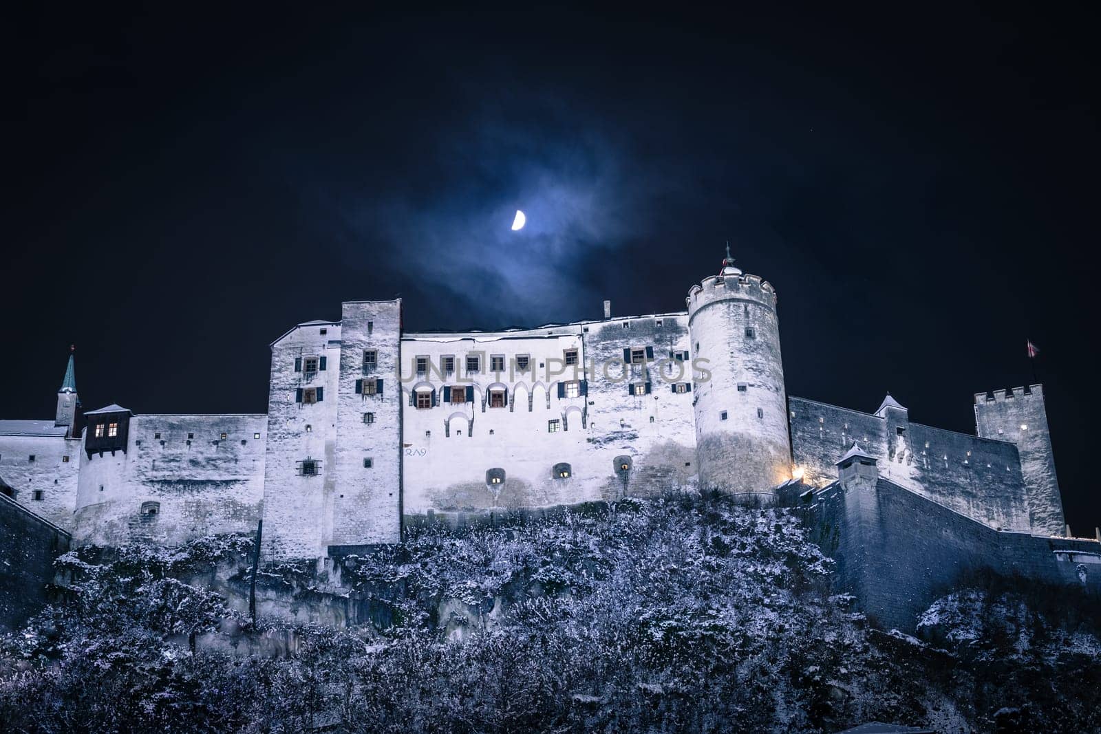 Fortress of Salzburg and the moon: Winterly in the night.