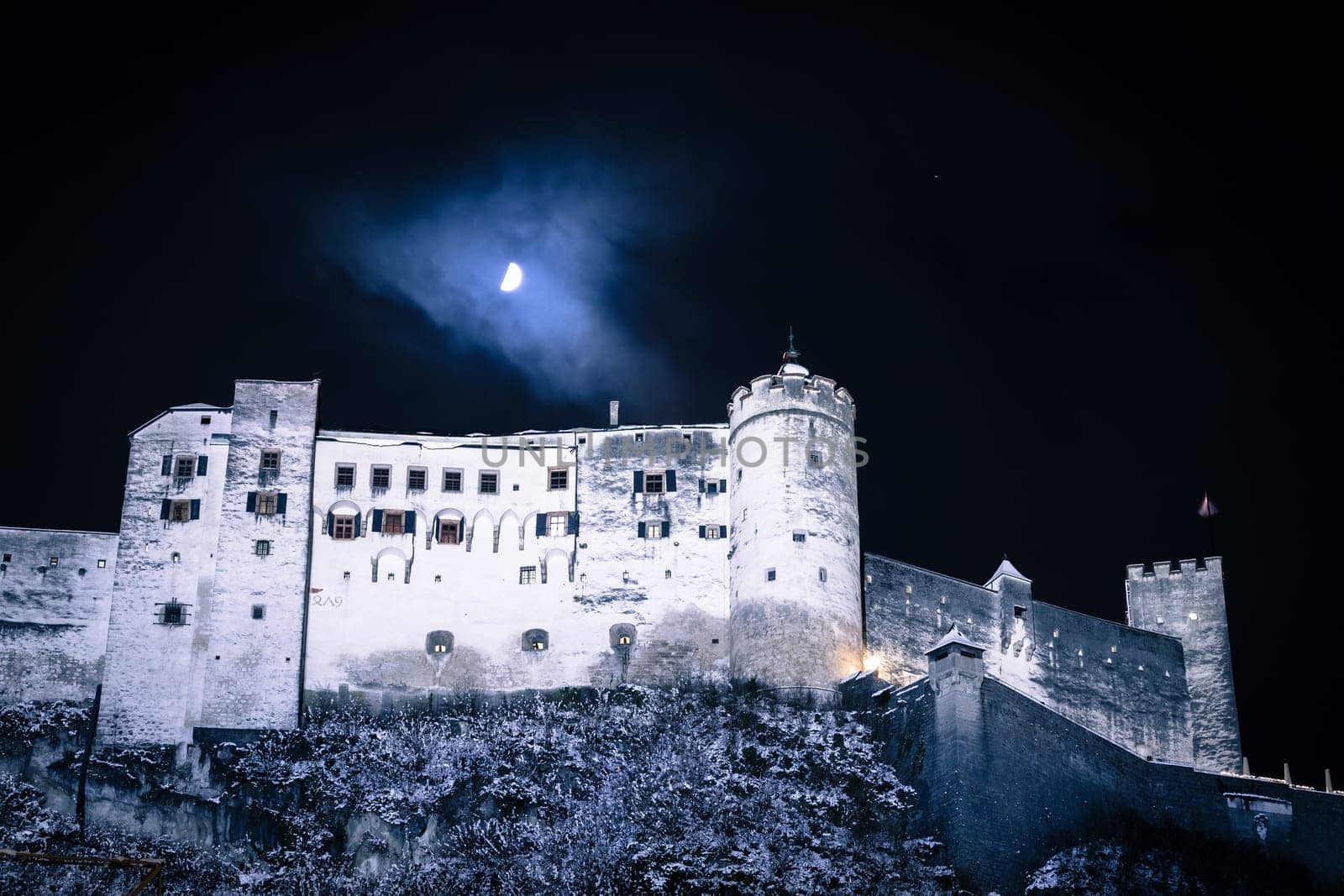 Fortress of Salzburg and the moon: Winterly in the night.