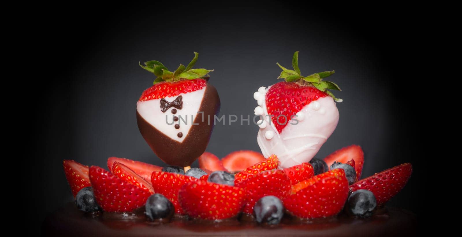 Confectionery luxury art trend marriage strawberries bridal couple embellishment, blueberries and frosting cream. Food symbol of love.