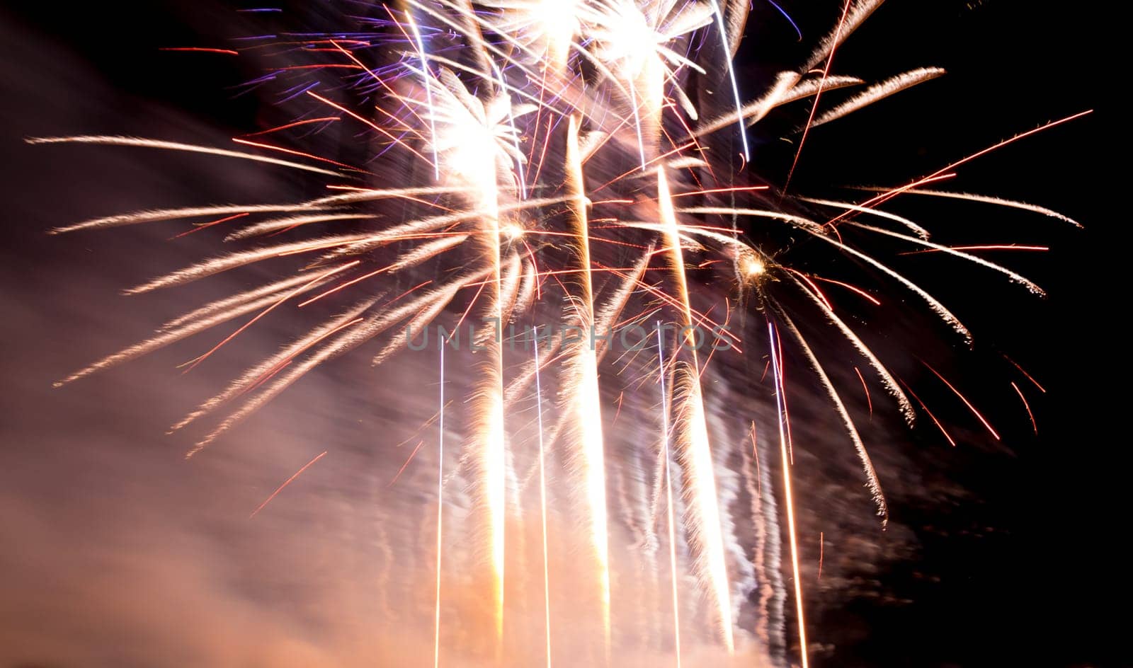 Premium entertainment magic star firework at e.g. New Years Eve or Independence Day party celebration. Black dark night background.