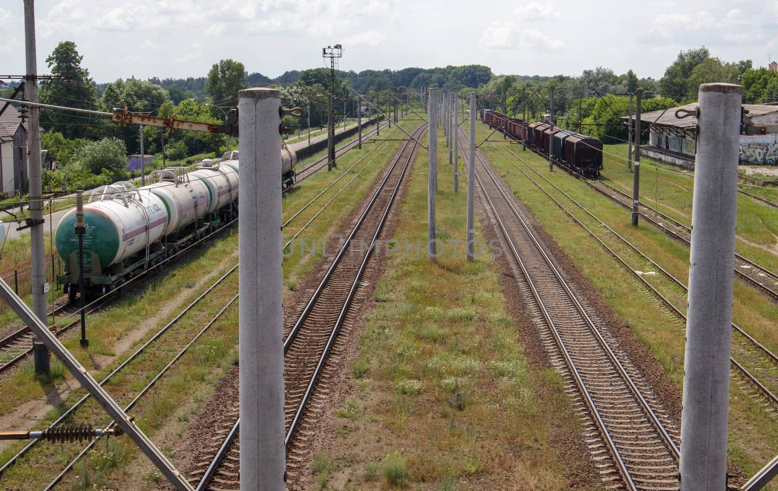 Railway stations with carriages and railroad tracks and trains, transport system. The way forward is the railroad. The modern railway infrastructure was reconstructed
