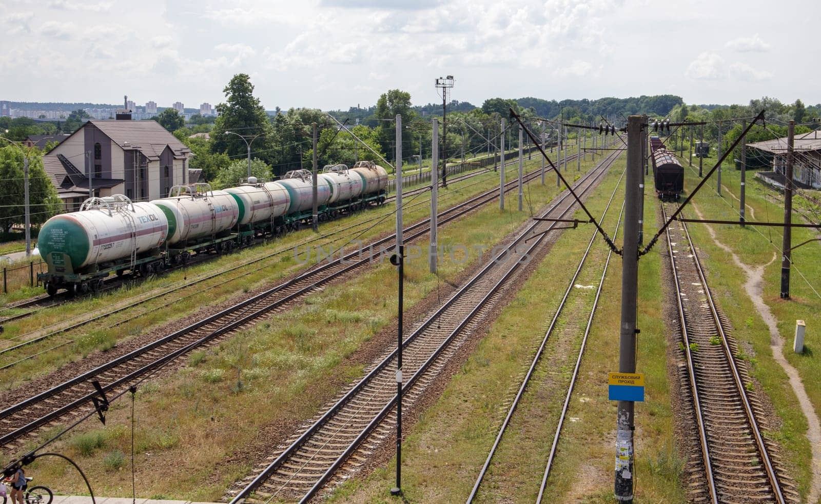 Railway stations with carriages and railroad tracks and trains, transport system. The way forward is the railroad. The modern railway infrastructure was reconstructed. Ukraine, Kiev - August 19, 2021