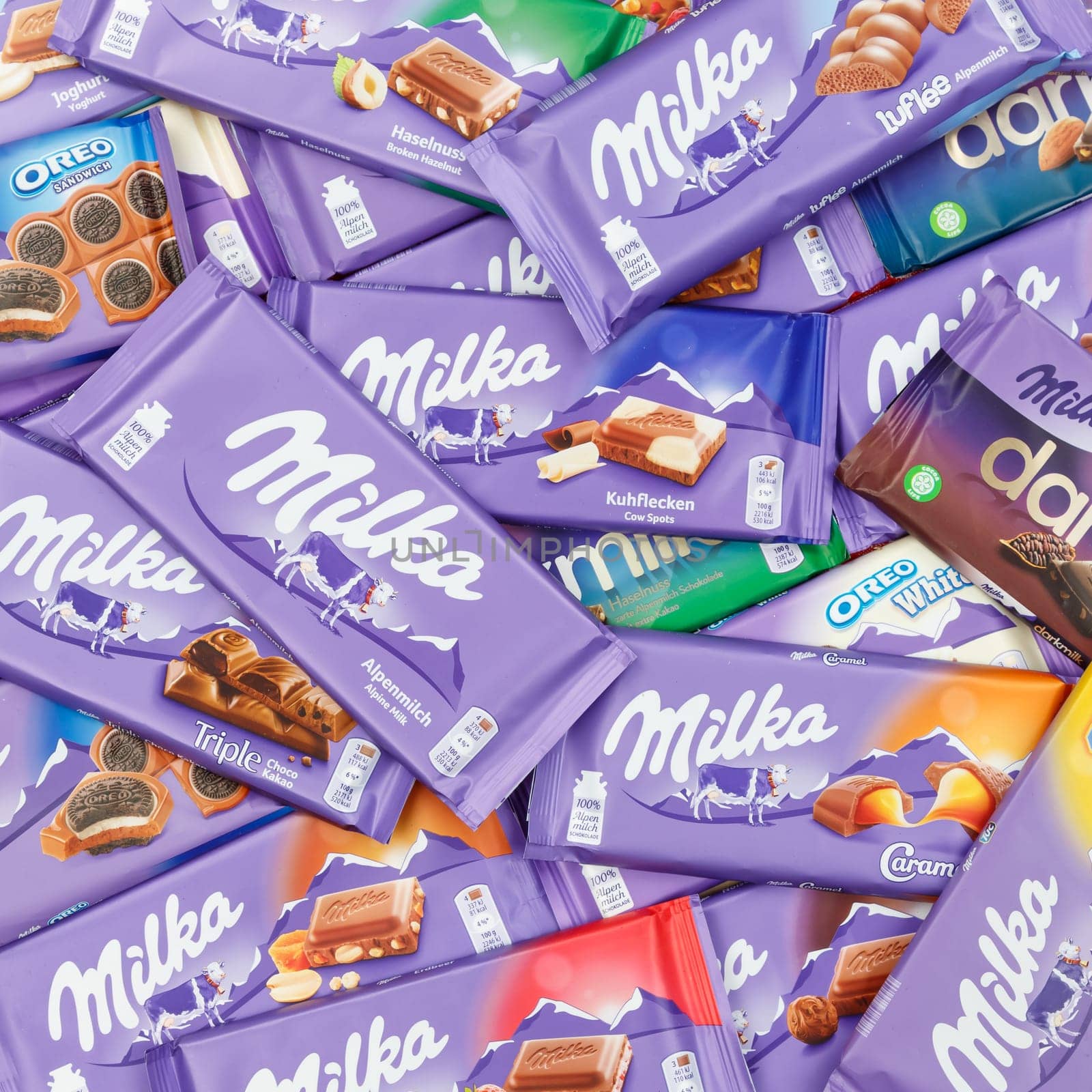Stuttgart, Germany - March 3, 2021: Milka chocolate chocolates different types variety background square in Germany.