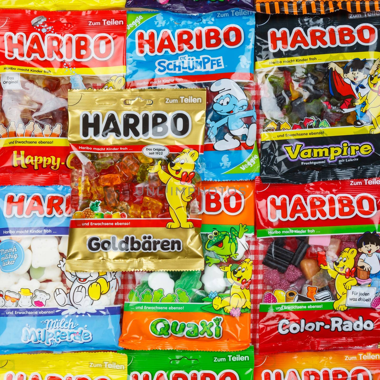 Stuttgart, Germany - March 7, 2021: Haribo gummy bear gummi candy candies different types variety background square in Stuttgart, Germany.