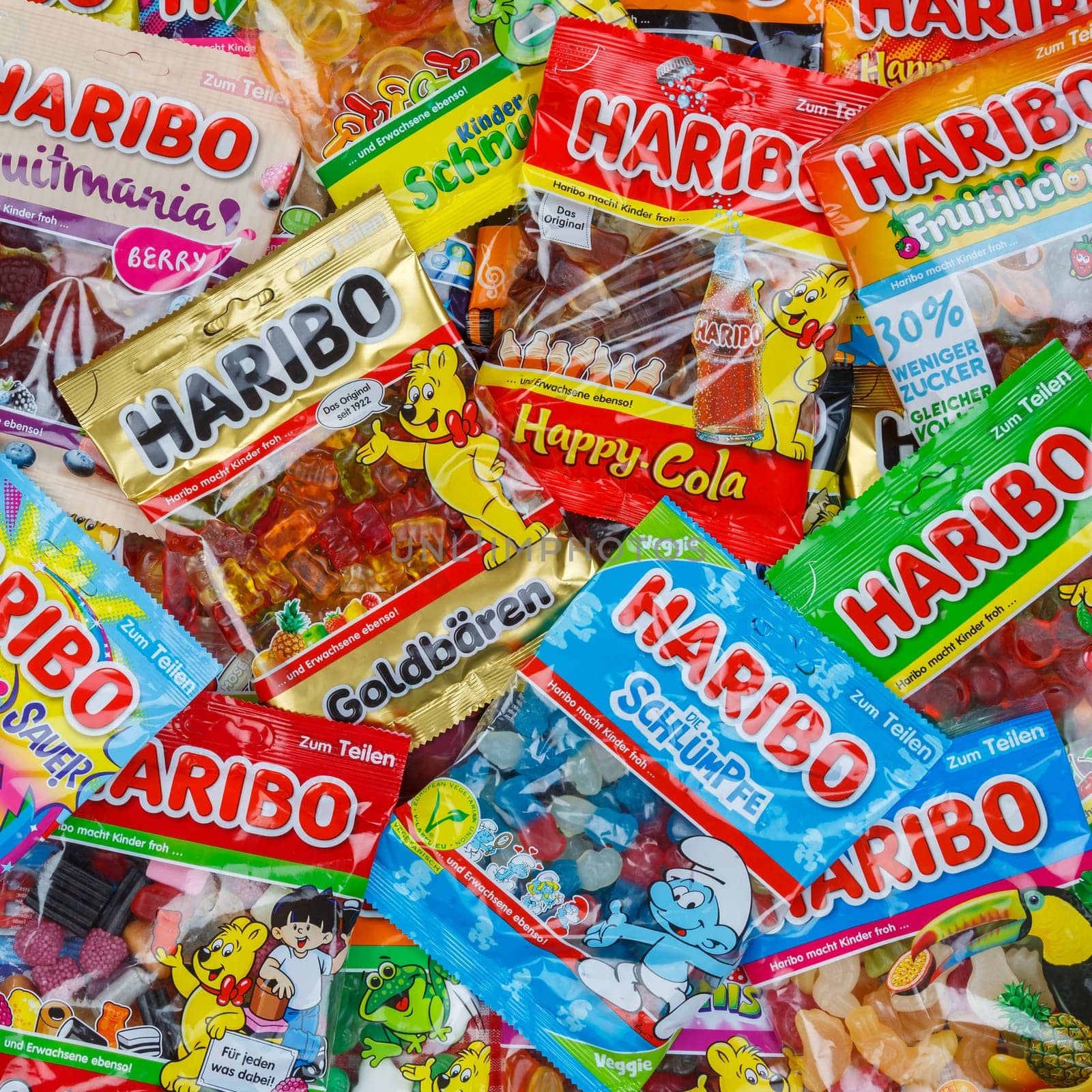 Stuttgart, Germany - March 7, 2021: Haribo gummy bear gummi candy candies different types variety background square in Stuttgart, Germany.