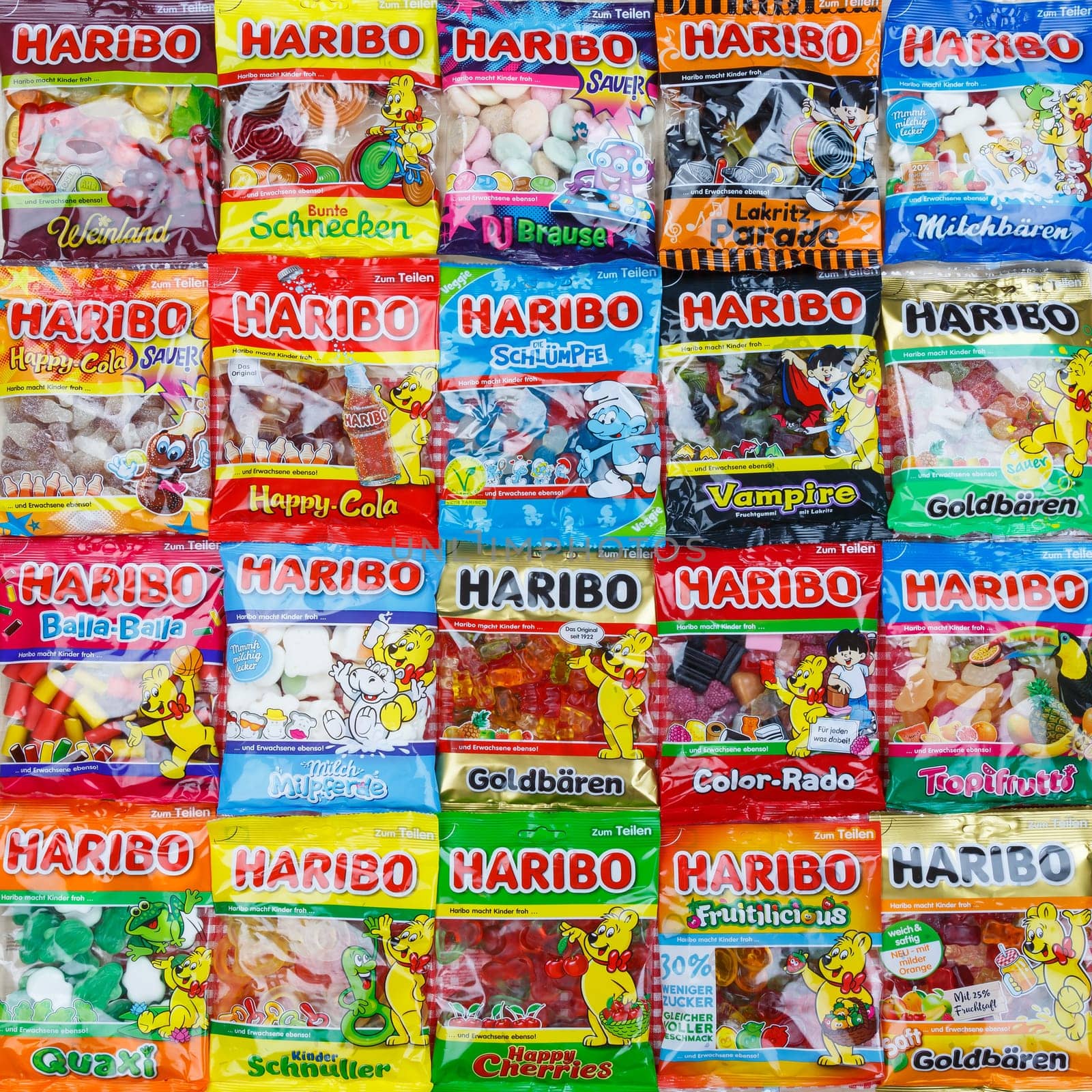 Stuttgart, Germany - March 7, 2021: Haribo gummy bear gummi candy candies different types variety background square in Stuttgart, Germany.