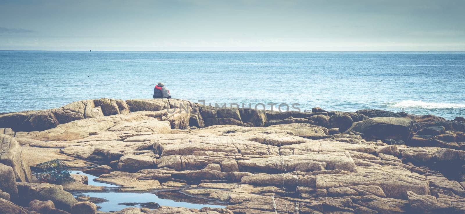Acadia National Park, ME, October 5, 2020: Elderly couple enjoying a beautiful day on the Atlantic coast of Acadia National Park