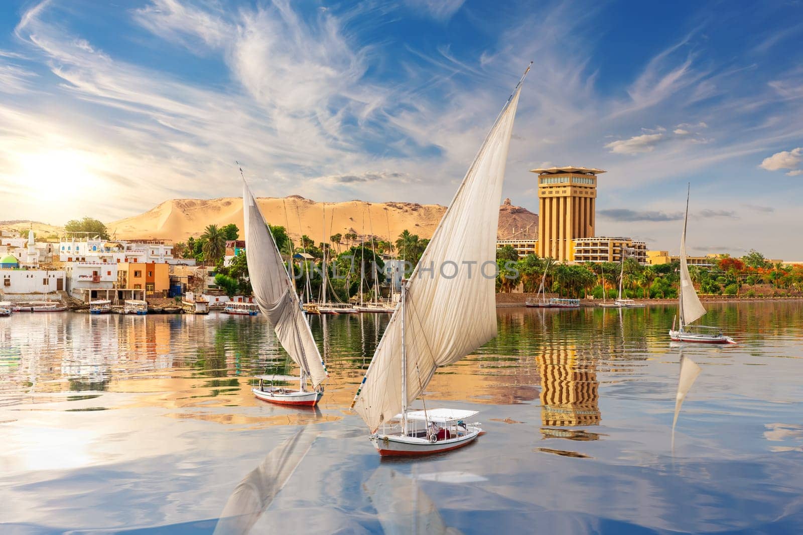 The Nile river and traditional feluccas in Aswan, Egypt, beautiful summer scenery.