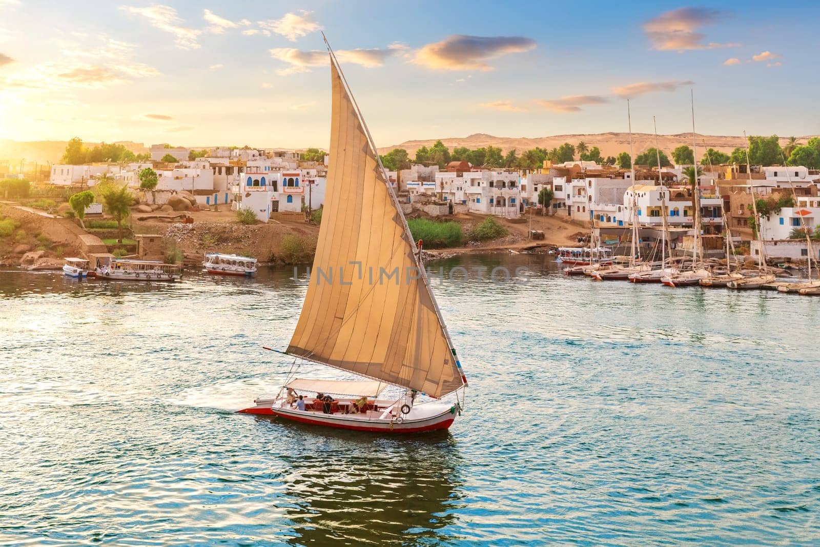 Felucca on the Nile near the banks of Aswan, Egypt.