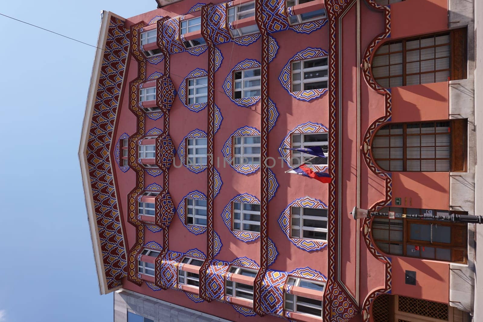 Artisty red facade on a house in Ljubljana, Slovenia, 2020