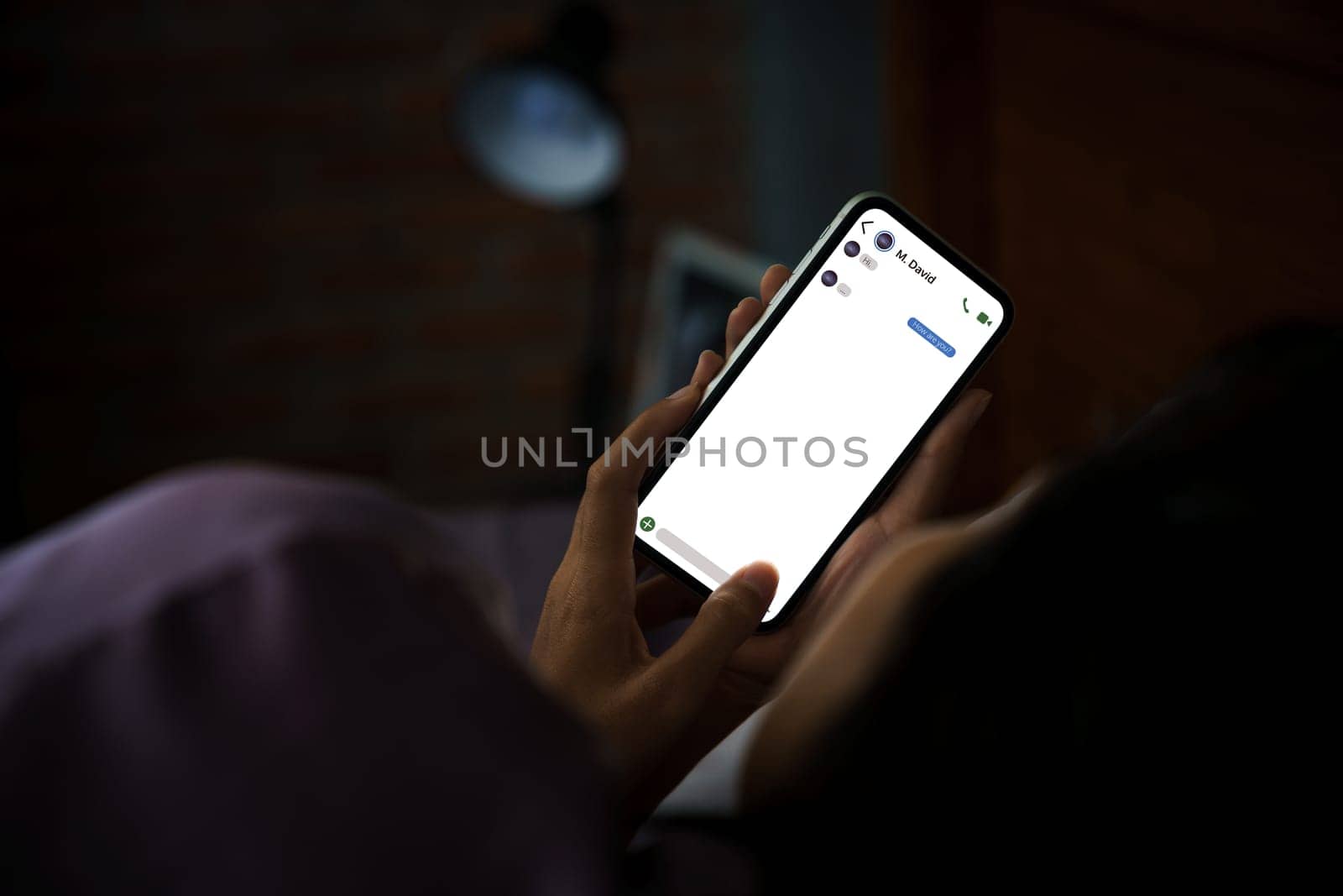 women using phone texting social on bed at night