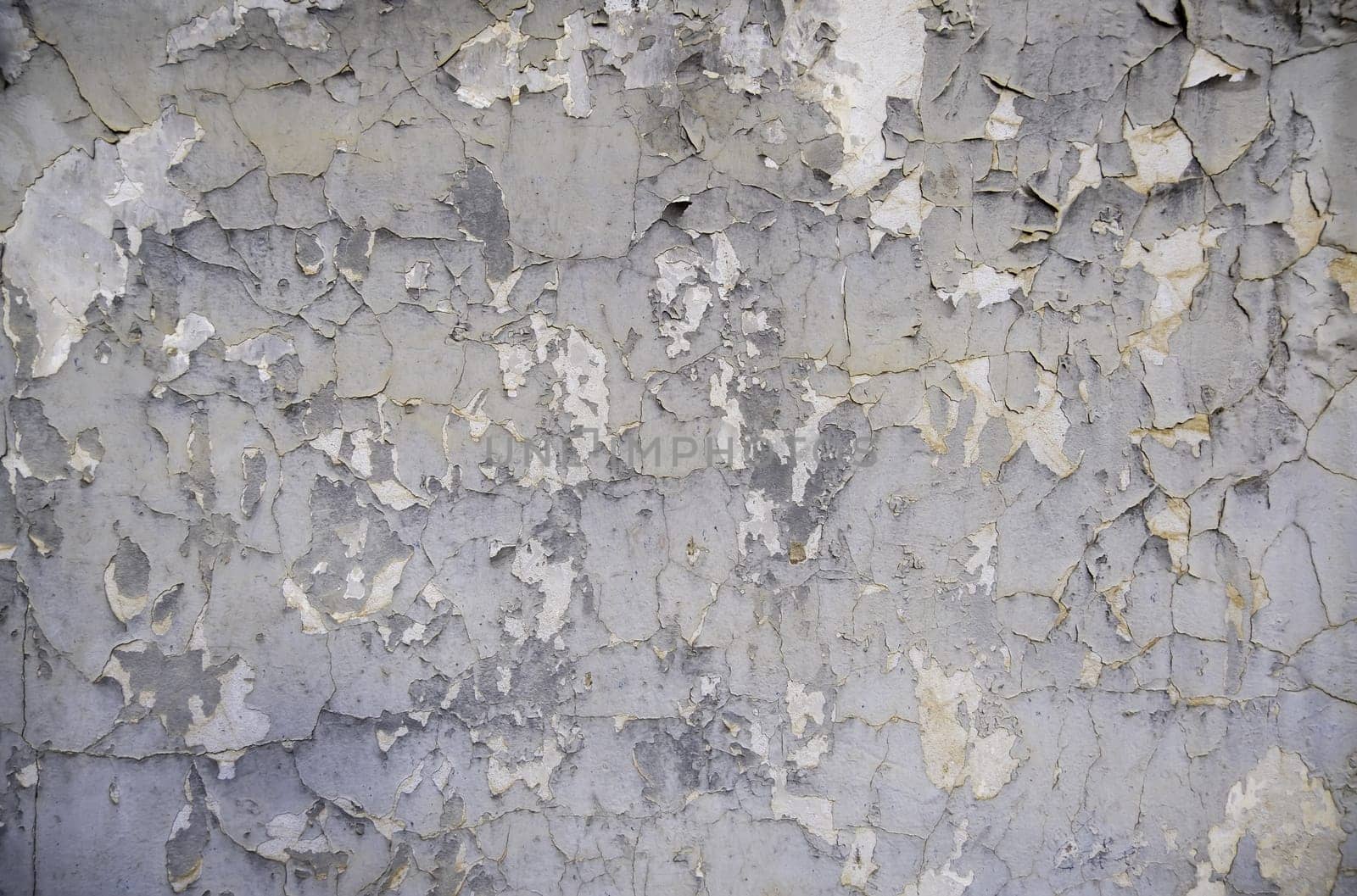 Detail of old damaged and ruined paint, abandonment and passage of time