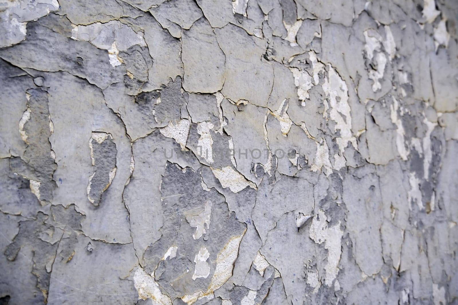 Detail of old damaged and ruined paint, abandonment and passage of time