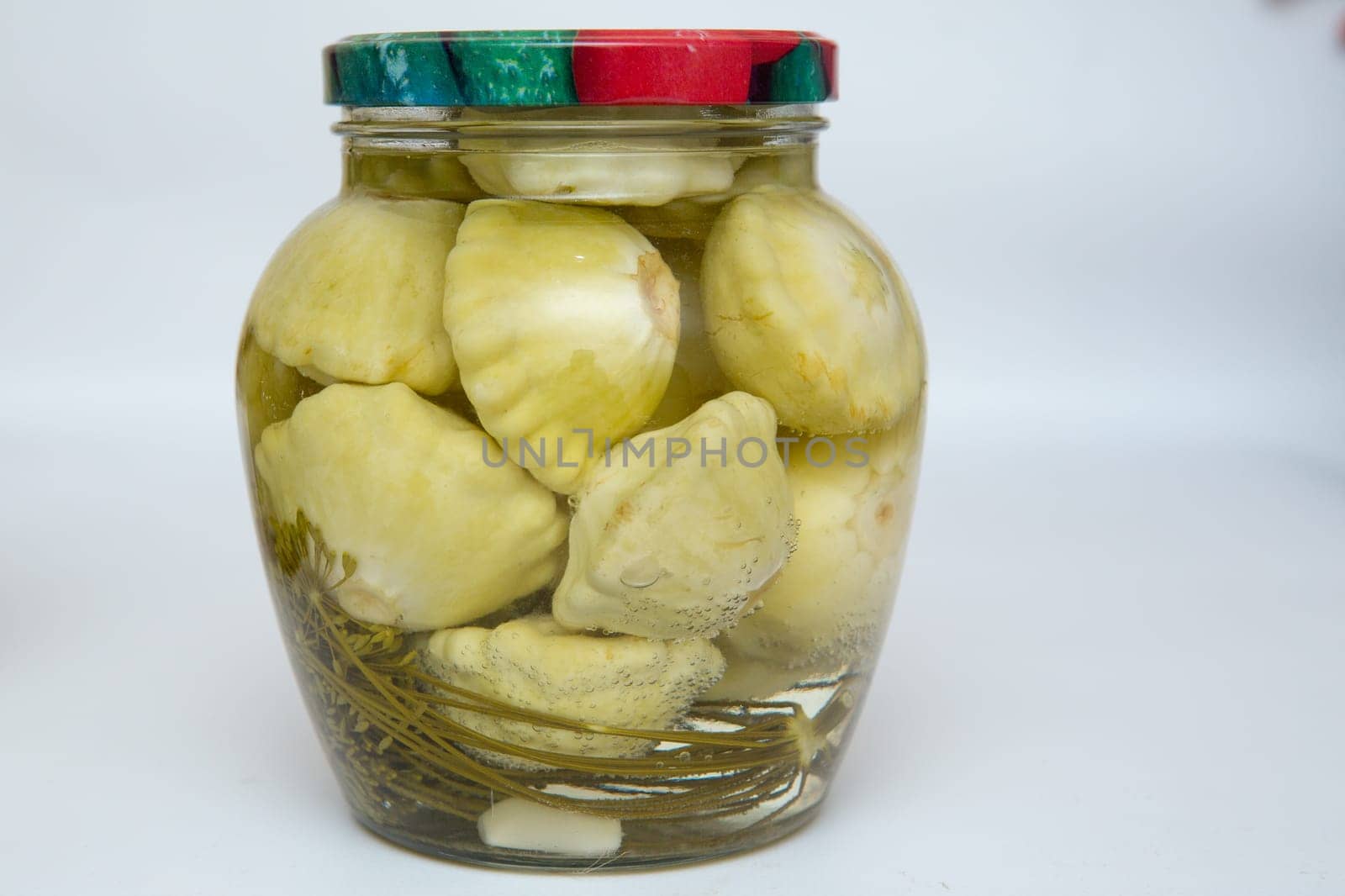canned vegetables in glass pots jars isolated on a white background an ecological natural food resource for the winter.