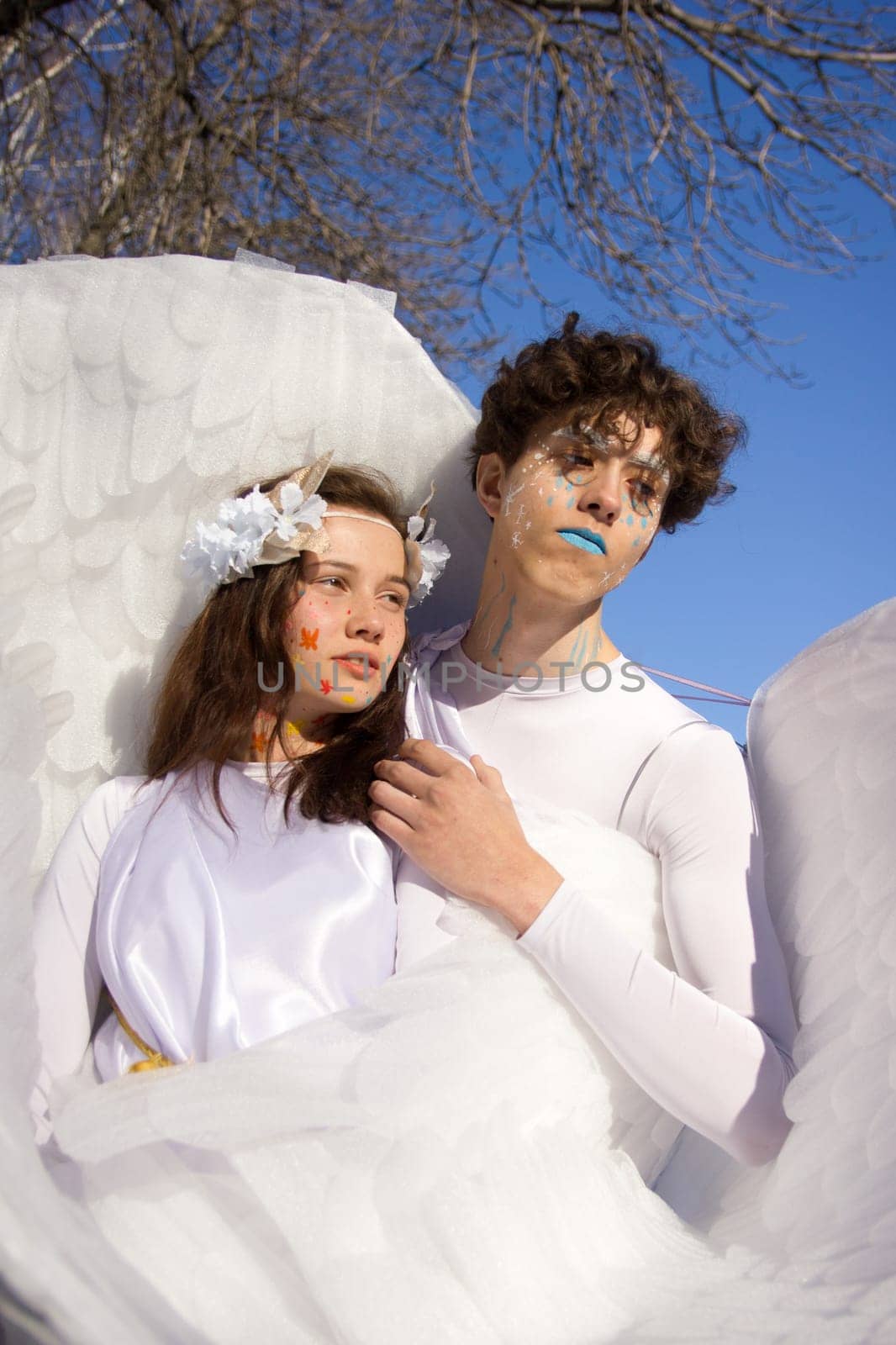 Fine art imagery. Woman and angel man embracing
