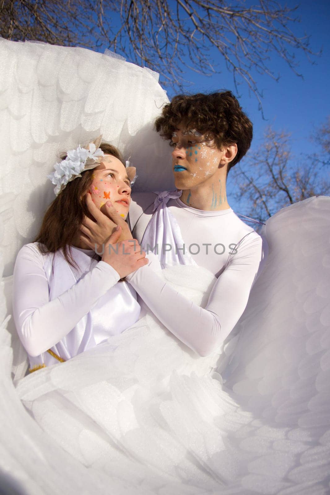 Fine art imagery. Woman and angel man embracing