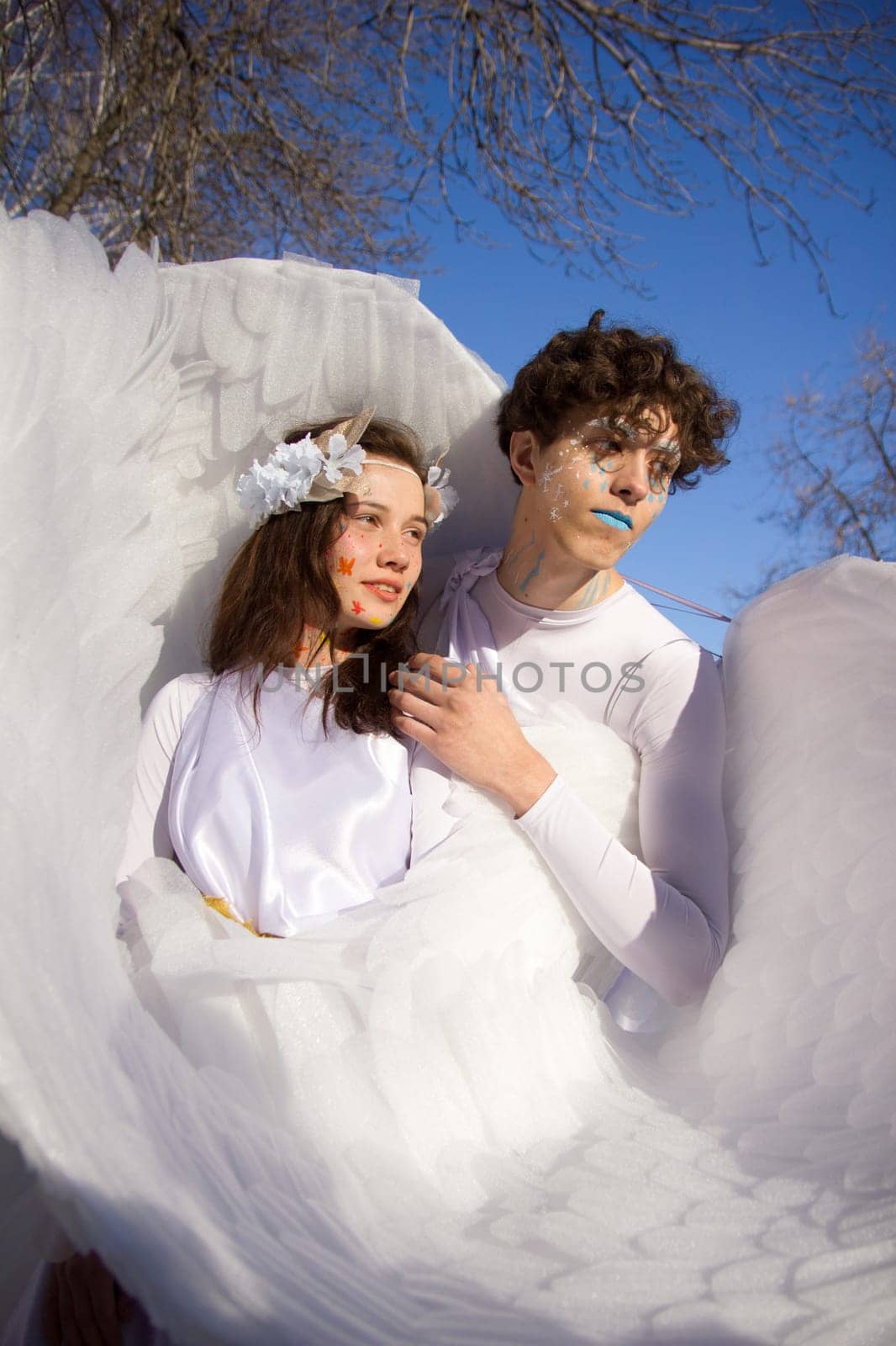Fine art imagery. Woman and angel man embracing