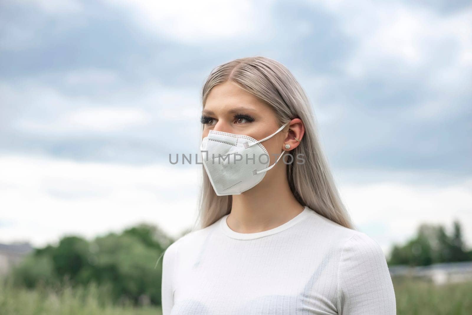young blond woman with mask