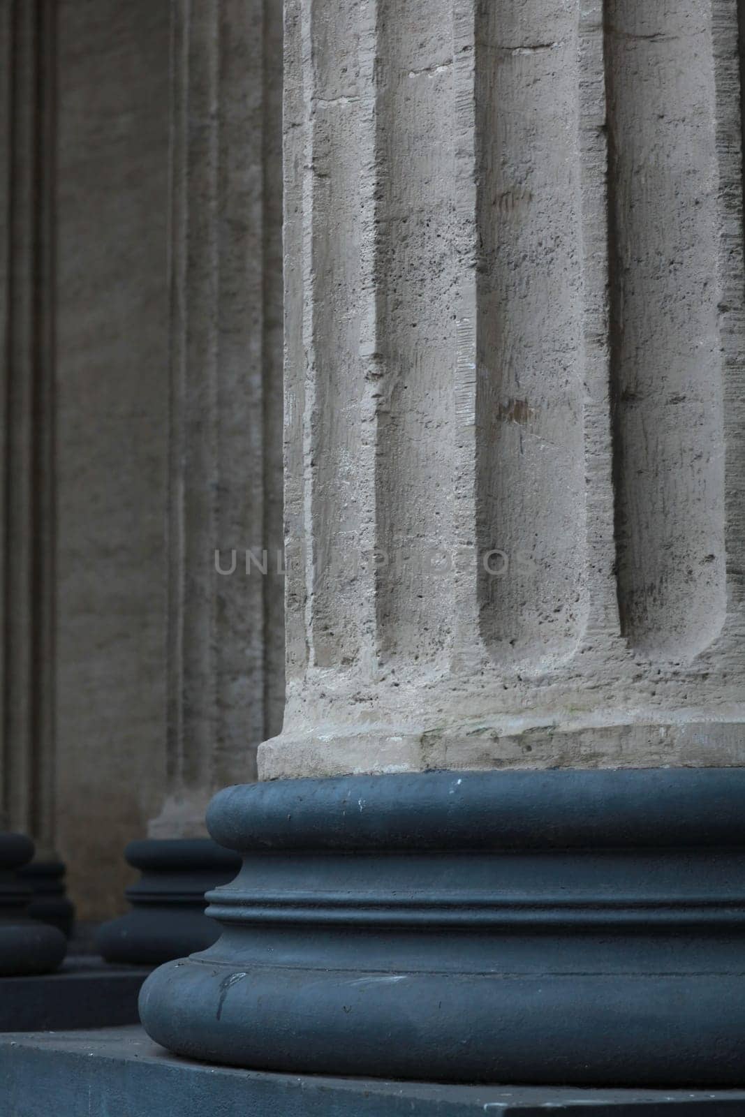 Corinthian columns on a bronze base close-up