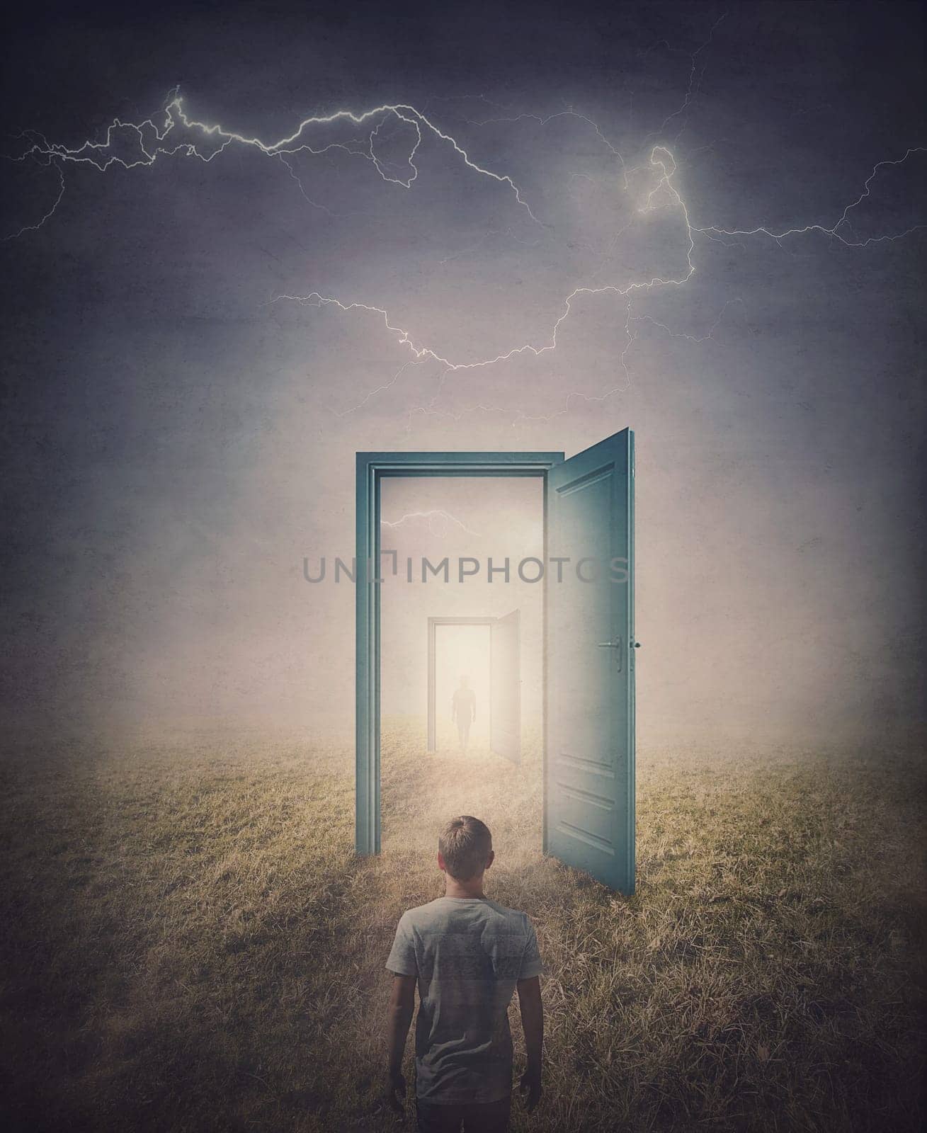 Teleportation doors concept. Rear view of a person standing in front of a doorway in the land, as seen in the mirror like a portal to another world. Magical and surreal scene with spooky lightnings