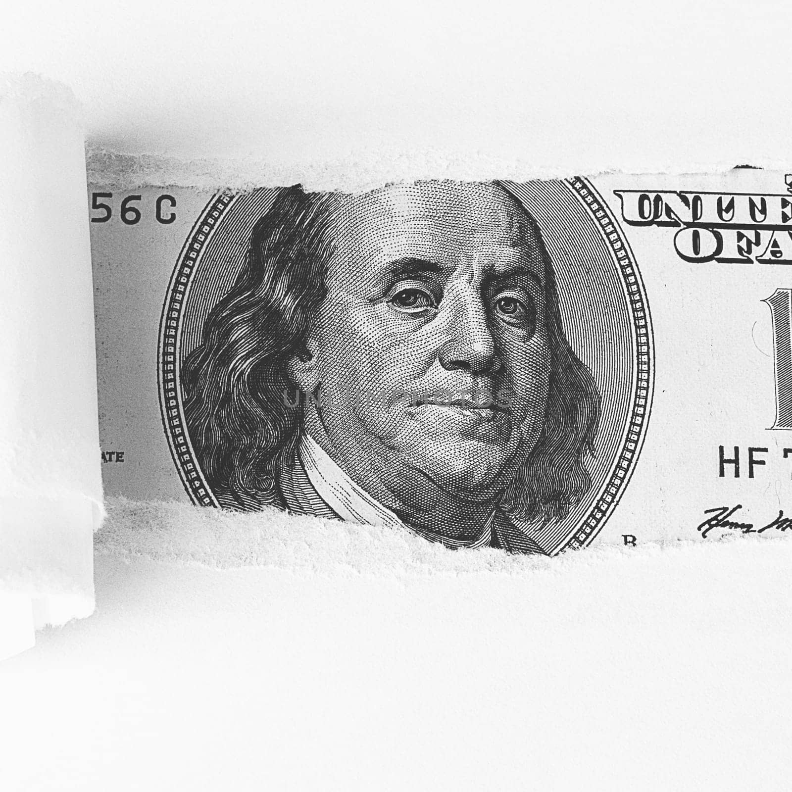 The face of Benjamin Franklin on a hundred-dollar bill, from a torn window in white paper. Background, white. Isolated. Close-up. A hundred-dollar American bill with the eyes of Benjamin Franklin. Black and white style. Place for logo, lettering, sign, template, mockup.