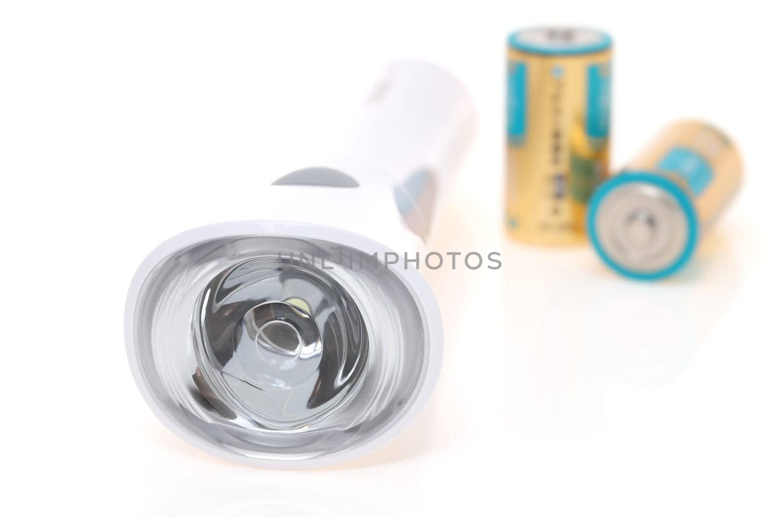Electric led pocket flashlight with dry cell isolated on white background