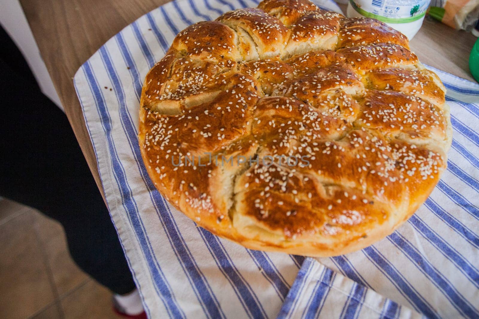 Traditional handmade holiday bread, food serving on table,  Eastern orthodox Easter day at home.