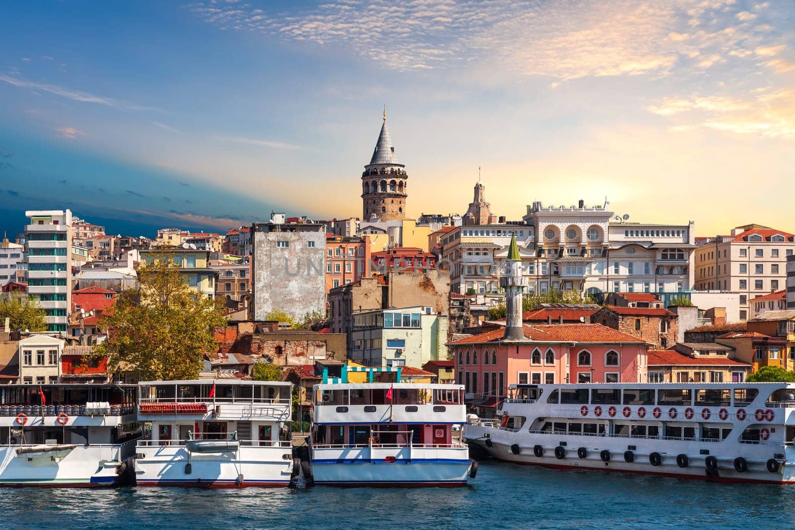 Ships near the Karakoy pier of Istanbul, view from the Golden Horn, Turkey.
