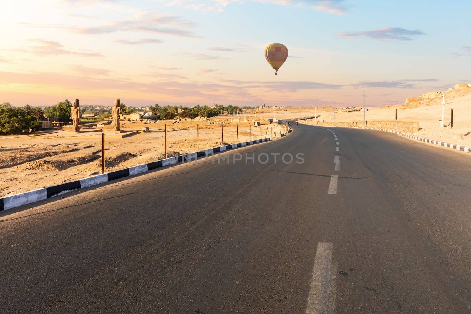 Road to the Mortuary Temple of Hatshepsut and air baloons, Luxor, Egypt.