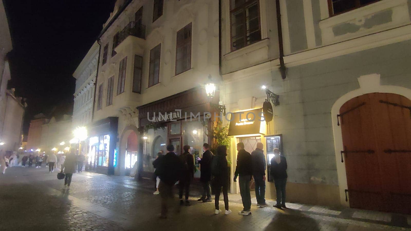 October 15 2024 Prague Czech Republic Europe Night street scene people building architecture . High quality photo