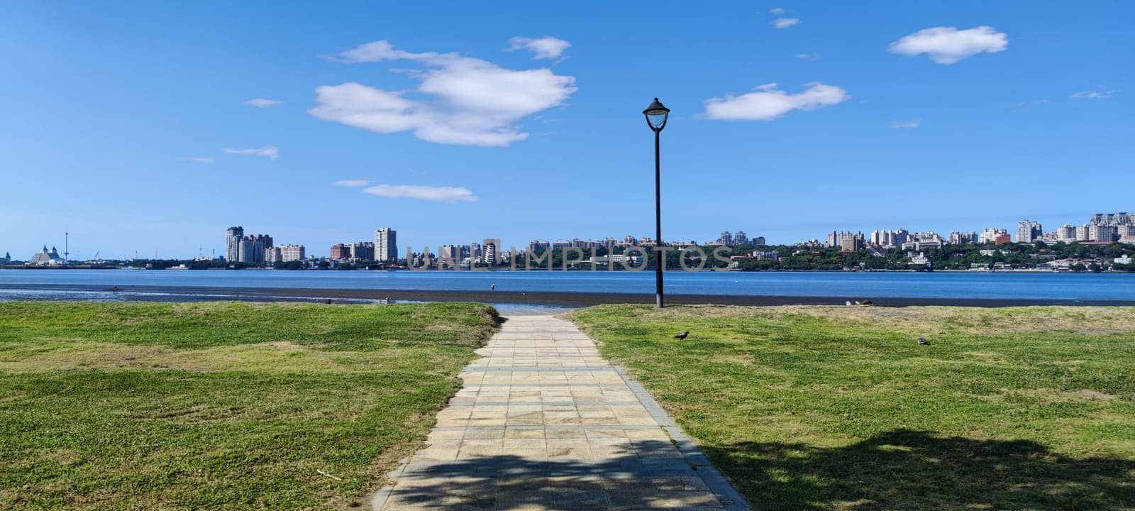 Tamsui, NEW TAIPEI CITY, TAIWAN - Sep 8, 2021 - City Tamsui Bali District in Taipei, Taiwan reflecting in the Tamsui River at nice day