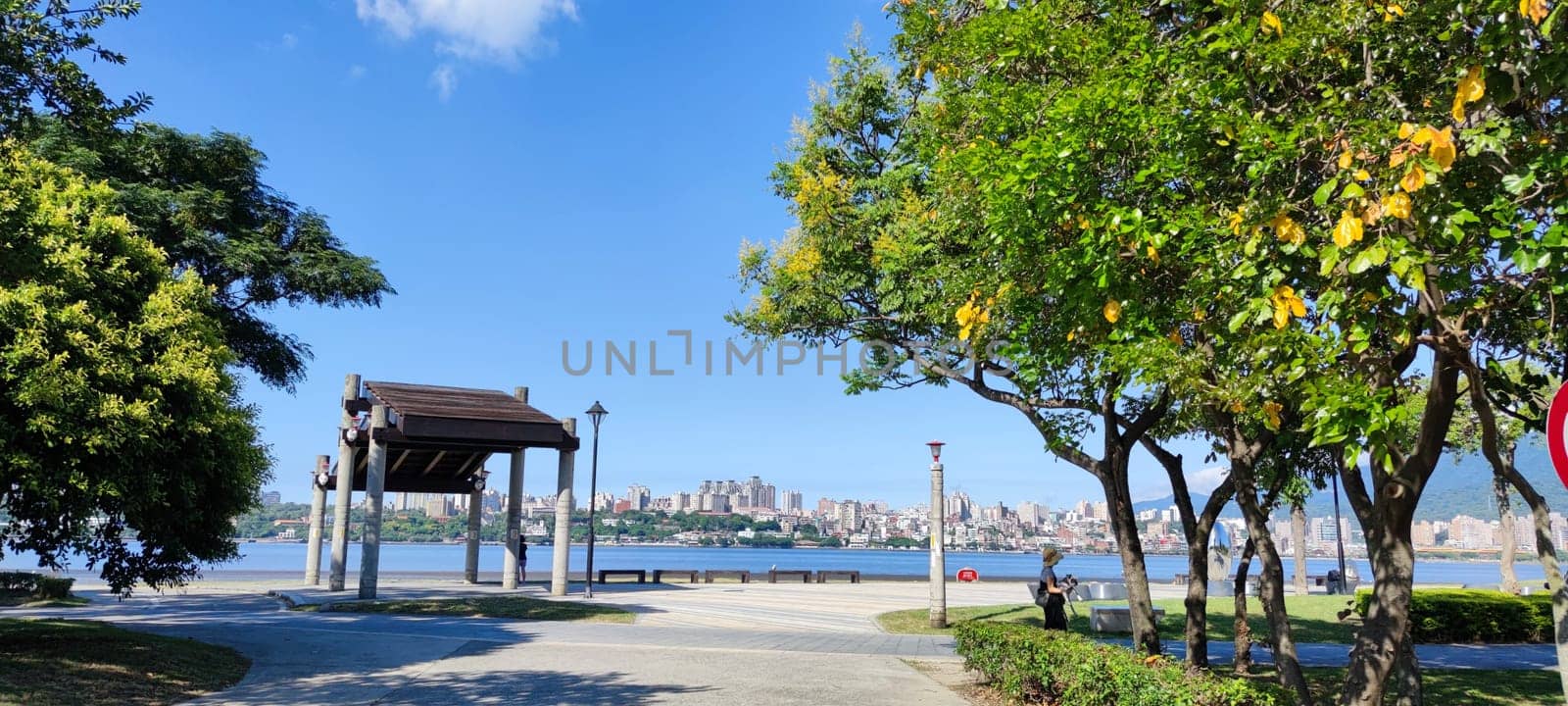 Tamsui, NEW TAIPEI CITY, TAIWAN - Sep 8, 2021 - City Tamsui Bali District in Taipei, Taiwan reflecting in the Tamsui River at nice day