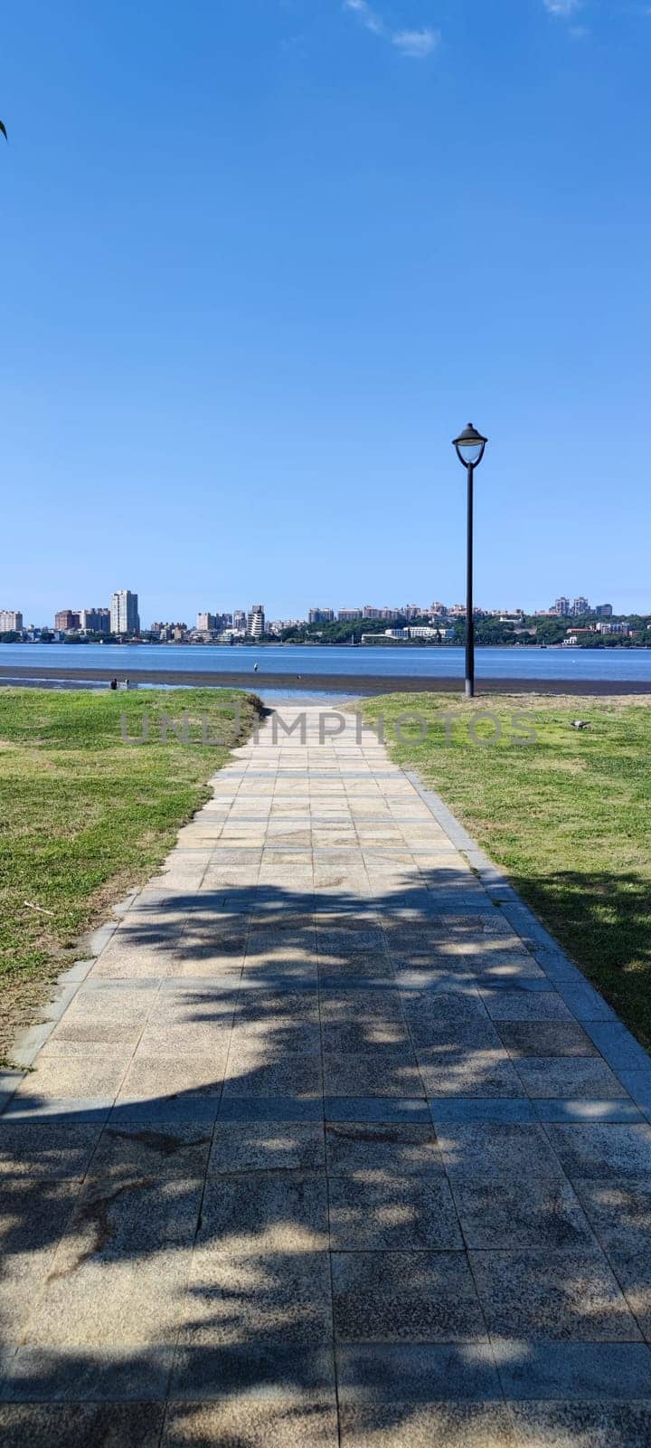 Tamsui, NEW TAIPEI CITY, TAIWAN - Sep 8, 2021 - City Tamsui Bali District in Taipei, Taiwan reflecting in the Tamsui River at nice day