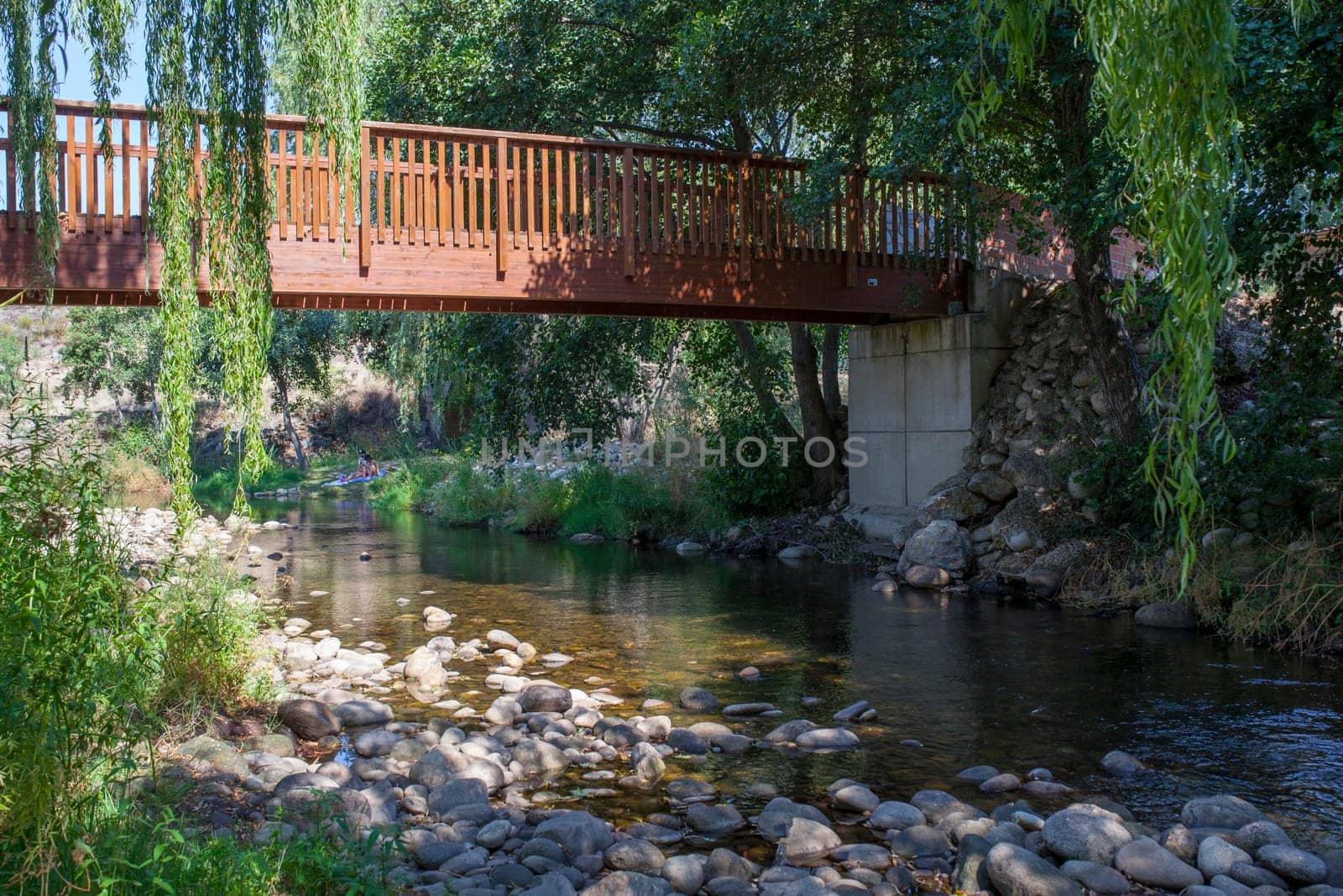 Pedestrian wooden bridge at Ambroz River recreation area of Abadia, Caceres, Extremadura, Spain