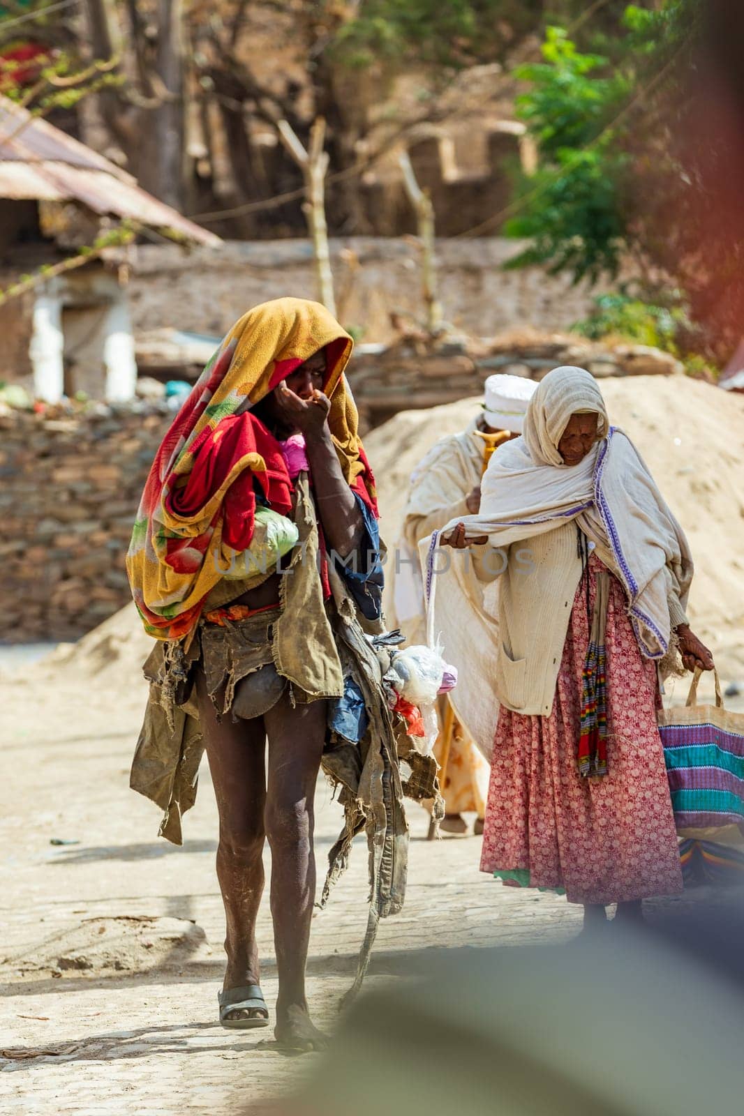 AXUM, ETHIOPIA, APRIL 27th.2019: Elder tigray women return from the morning Mass at the church of Our Lady of Zion on April 27, 2019 in Aksum, Ethiopia Africa